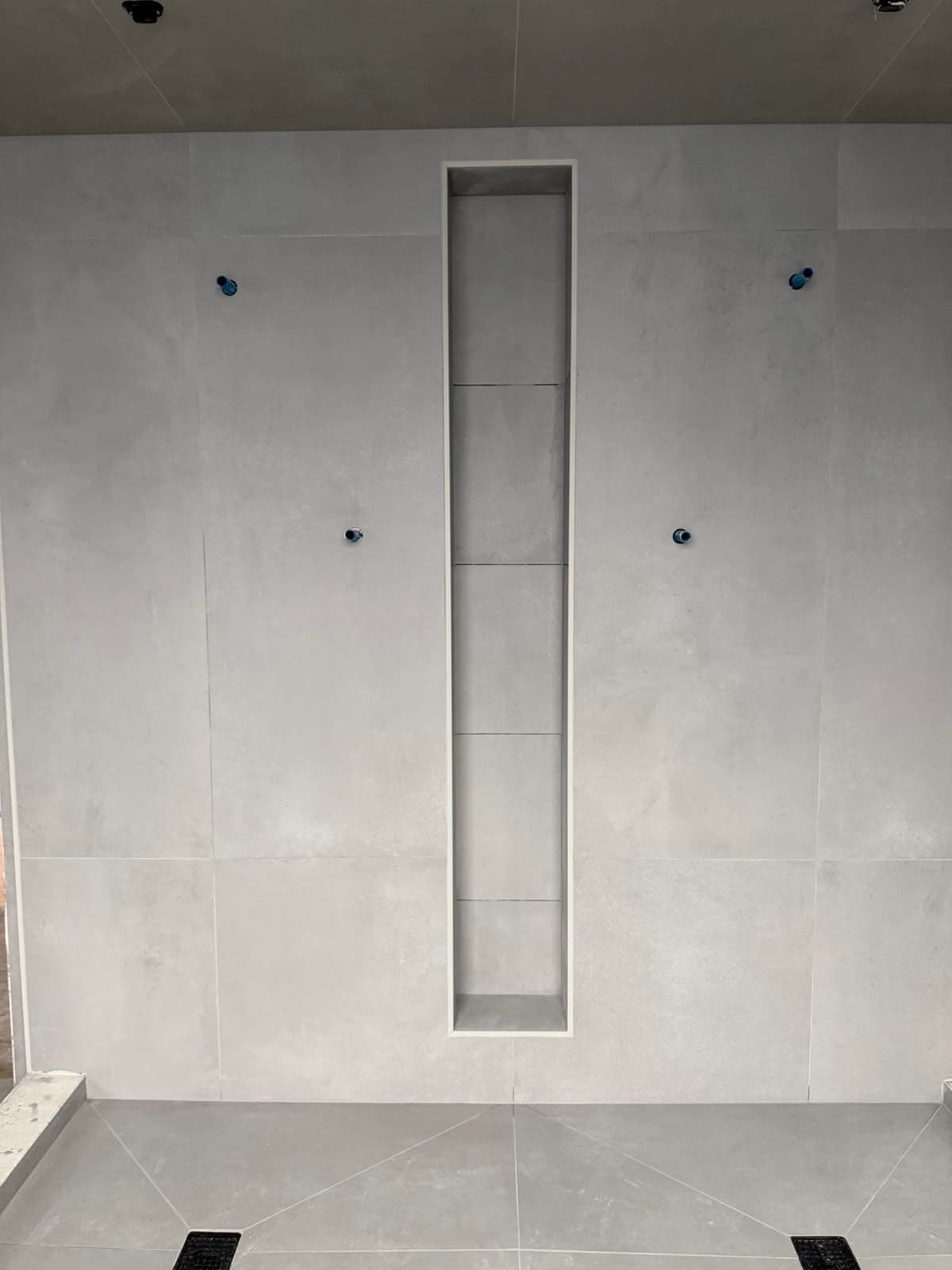 Shower niche with large format tile